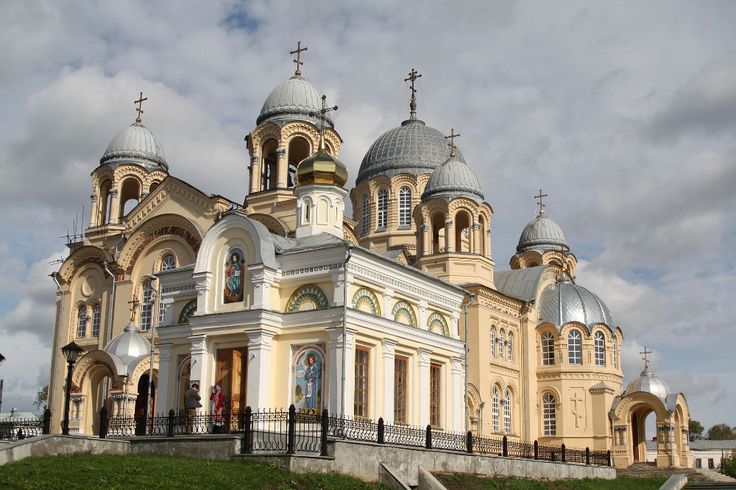 an old church with two towers and three spires