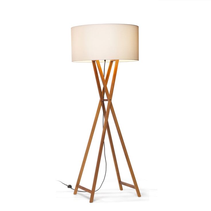 a wooden floor lamp with a white shade