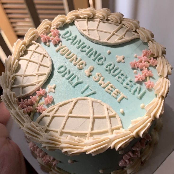 there is a cake that has been decorated with flowers and words on the frosting