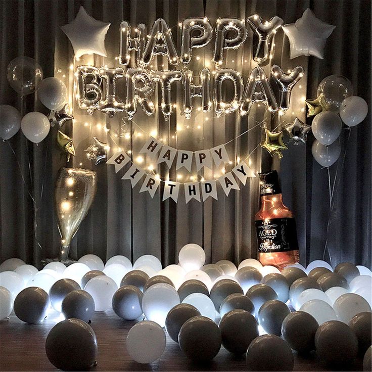 a birthday party with balloons and lights