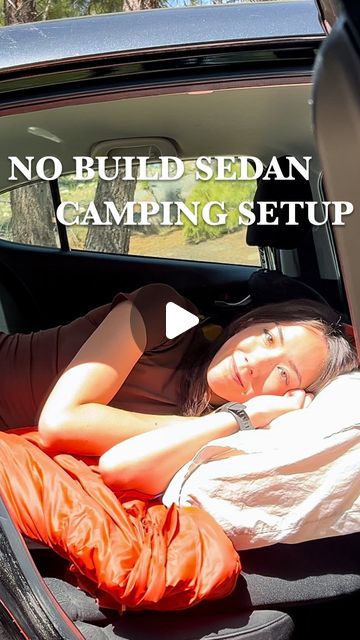 a woman laying in the back seat of a car with text overlay reading no build sedan camping setup