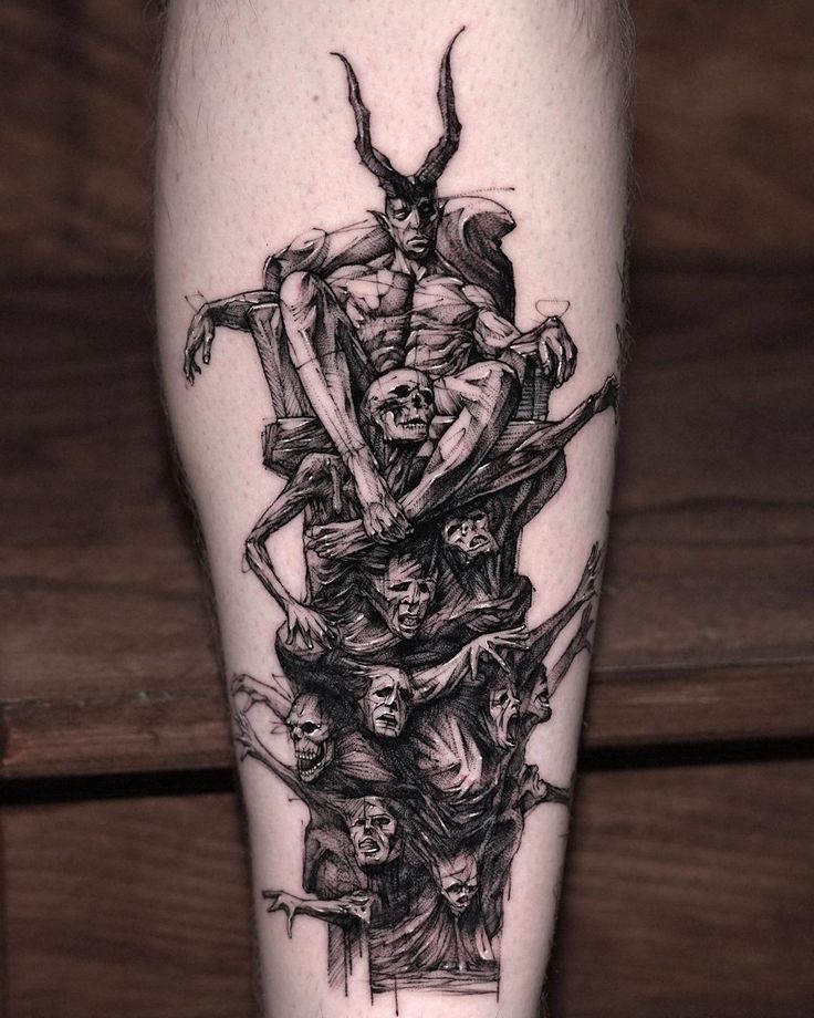 a black and white tattoo on the leg of a man's leg with skeletons