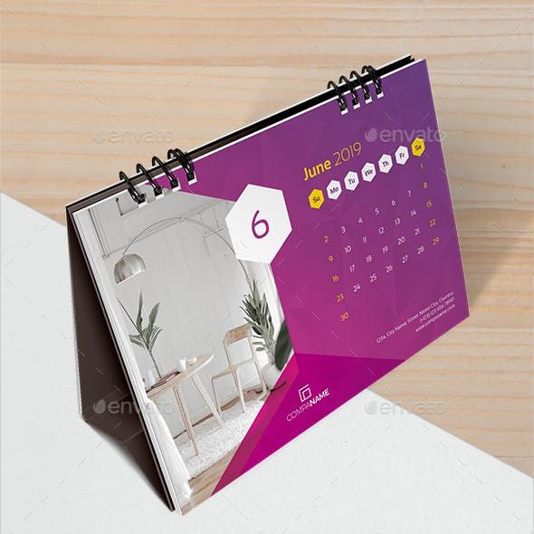 a desk calendar with an image of a room on it