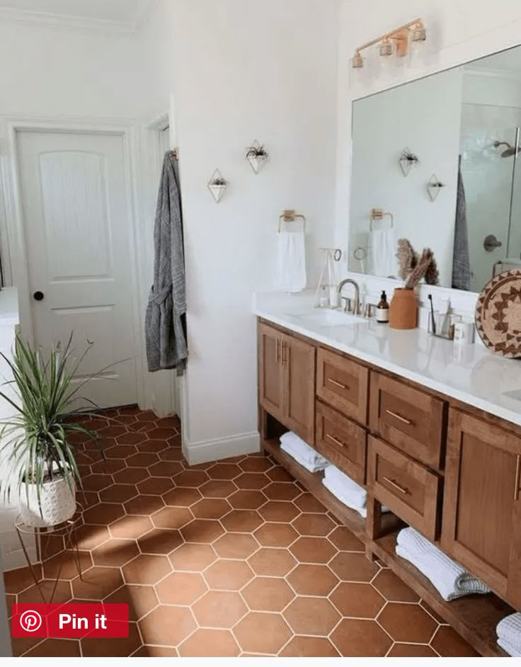 a bathroom with two sinks and mirrors in it