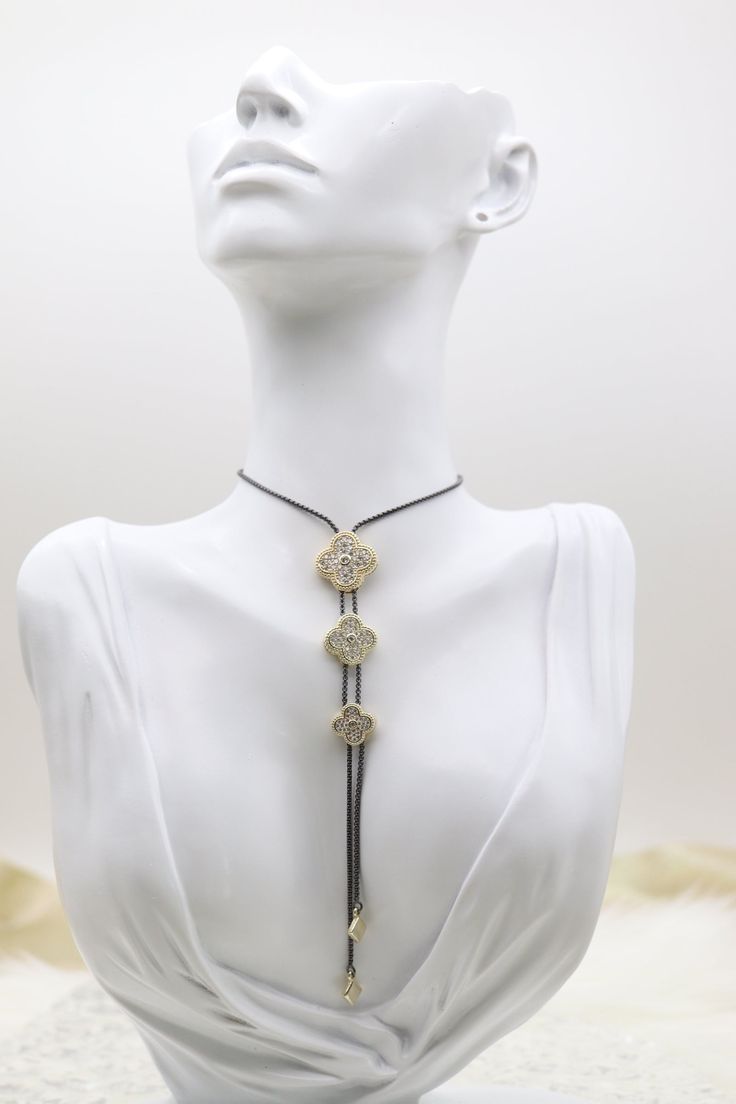 The Three Tier Clover Adjustable Necklace showcases a charming design with three tiers of delicate clover-shaped pendants, each tier slightly longer than the one above it for a graceful cascading effect. This elegant piece is adjustable, allowing it to be worn at various lengths to suit different necklines and personal styles. Length: 38” Closure: Adjustable Necklace Clover: 18.0 mm; 15.0 mm; 12.3 mm Material: Brass with 18K Gold Plating and Rhodium Coating Lead Free and Hypoallergenic Different Necklines, Tiered Necklace, Sweet Jewelry, Toggle Necklace, Clover Necklace, Fashion Aesthetics, Three Tier, Adjustable Necklace, Jewelry Inspo