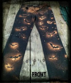 a pair of leggings with bats on them and the words back written in black