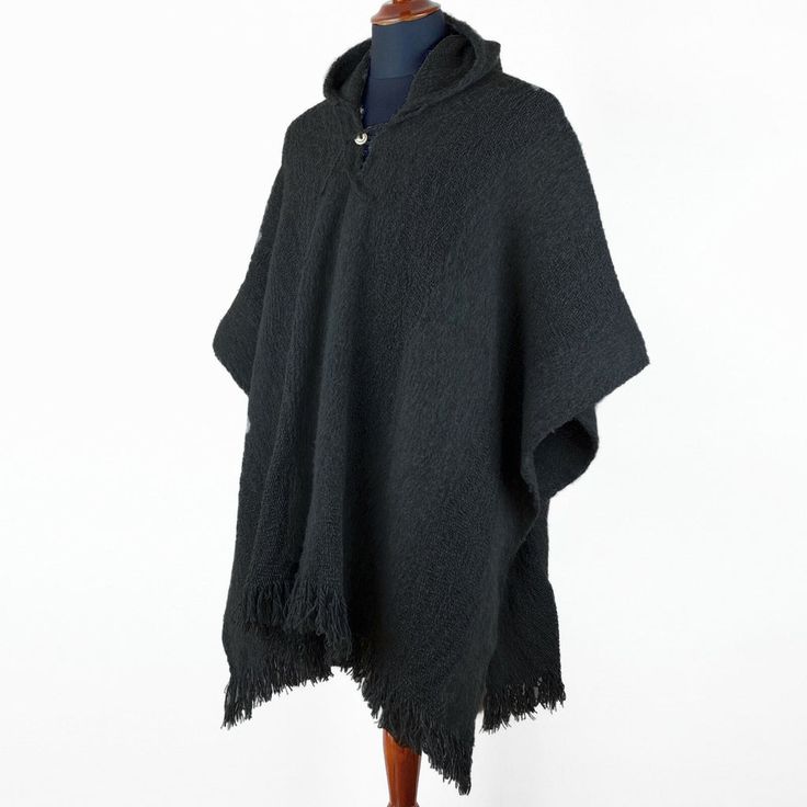 Llama Wool Unisex South American Handwoven Hooded Poncho - solid black pattern Black Alpaca Poncho For Winter, Black Alpaca Cape For Winter, Black Alpaca Outerwear For Winter, Casual Alpaca Poncho For Winter, Casual Alpaca Poncho For Fall, Casual Wool Poncho, Casual Wool Poncho One Size, Casual One-size-fits-all Wool Poncho, Poncho Coat Cape