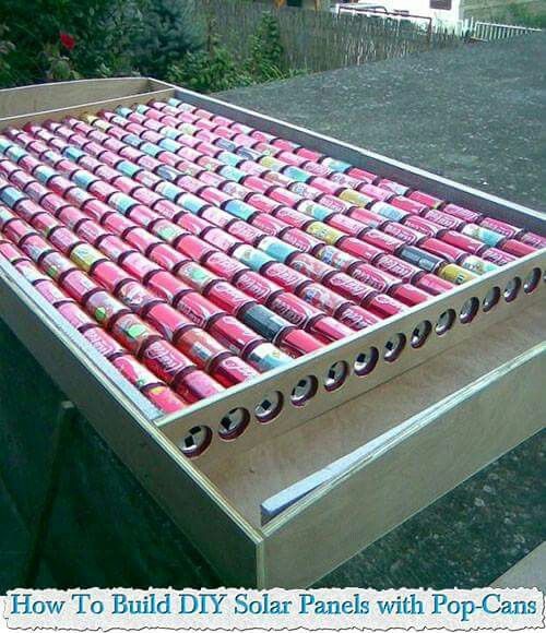 a box filled with lots of pink and green cans sitting on top of a table