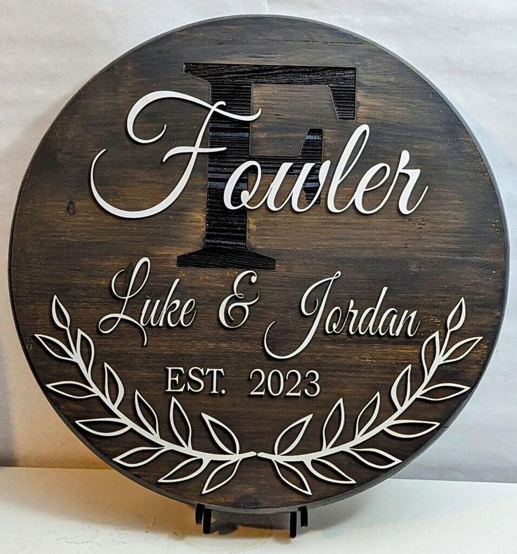 a wooden plaque with the letter f on it