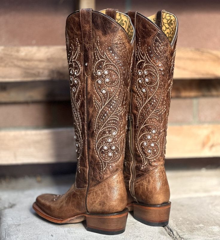 The price INCLUDES taxes and shipping within the United States.
This is the RC-Hacienda style in a sand color, a long shaft boot (17 1/2") with a square toe and beautiful embroidery that highlights its elegance. Made of high quality leather with a cowhide sole and leather lining, it is ideal for those with a slimmer calf, as the long shaft can be tight, although it has a zipper for easy putting on. Also available in a dark brown color, this is a boot that will make you say "wow" when you see it Vaquera Boots, Brown Cowgirl Boots, Slim Calves, Western Fits, Cap Decoration, Vegas Style, Quince Ideas, Hacienda Style, When You See It