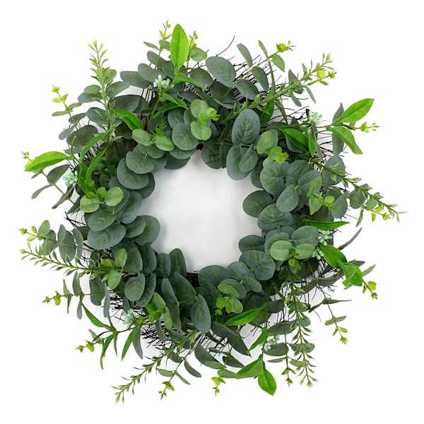 a wreath made out of green leaves and greenery