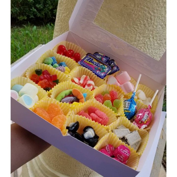 a box filled with lots of different types of candies