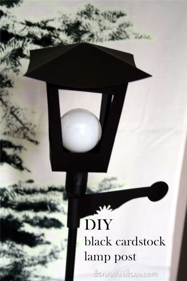 a black post light with a white ball on it's top and the words diy