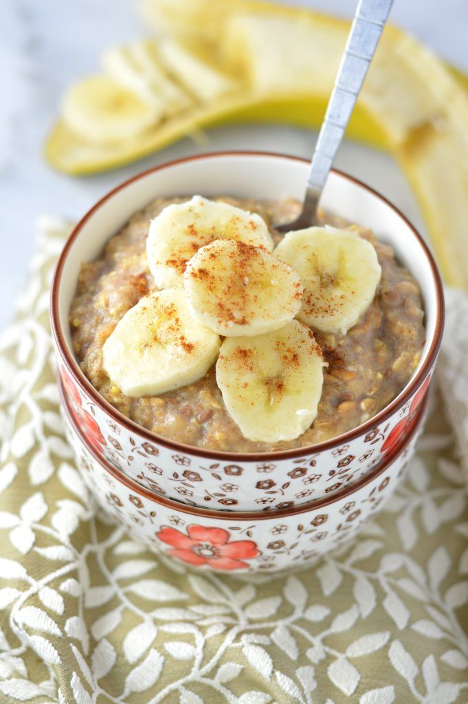 a bowl filled with oatmeal topped with banana slices and cinnamon on top