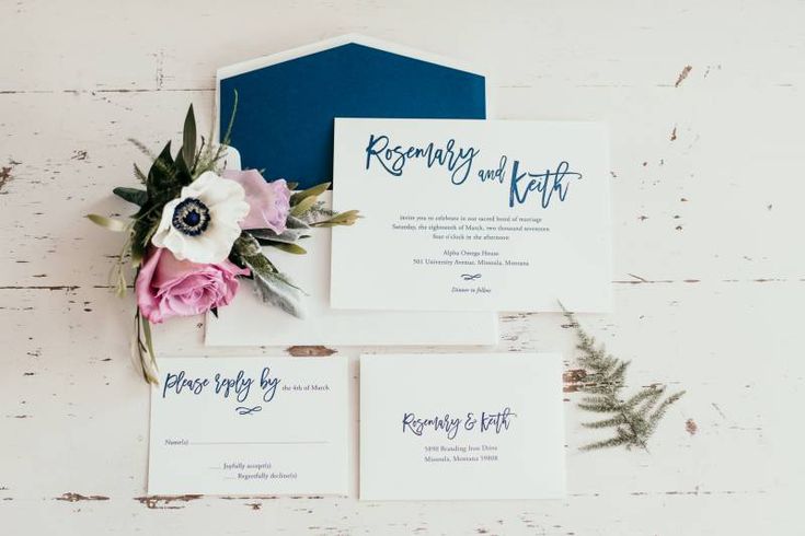 the wedding stationery was done in navy and pink