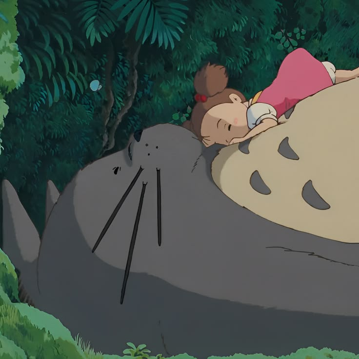 a person laying on top of a hippo in the jungle