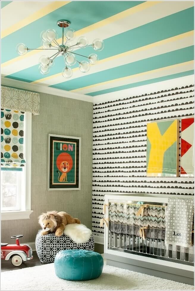 a child's room with striped walls and furniture