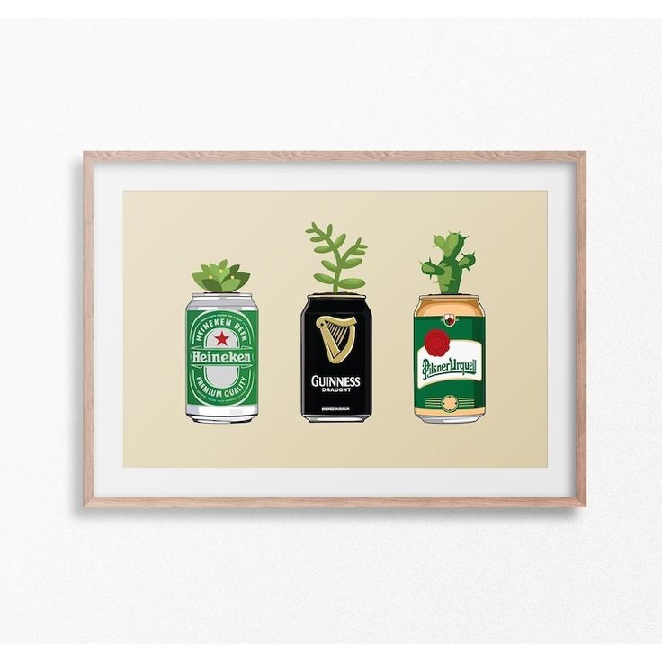 three beer cans with plants growing out of them in front of a white wall mounted on a wooden frame