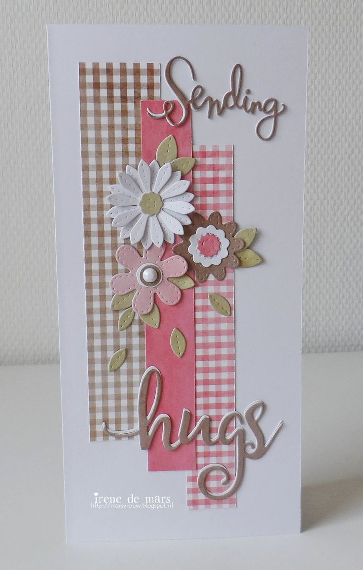 a handmade card with flowers and the words sending hugs on it's side