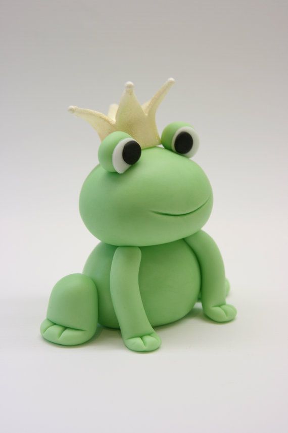 a toy frog with a crown on its head