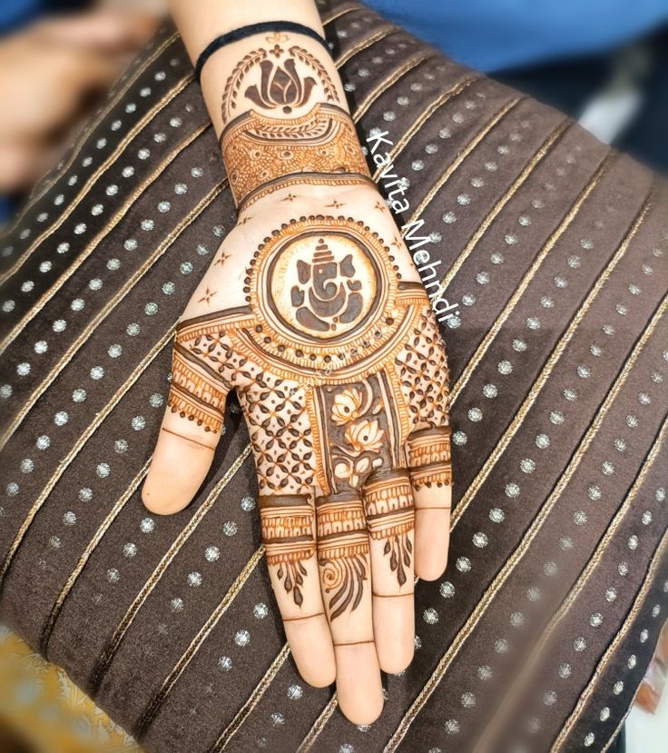 a person's hand is decorated with hennap and designs on the palm