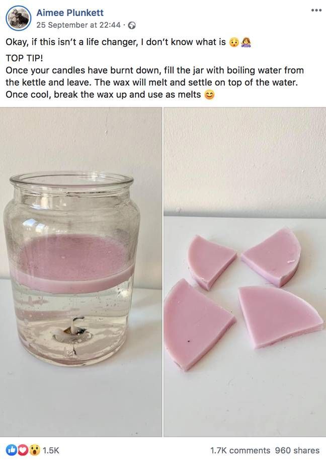 some pink soaps are in a glass with water