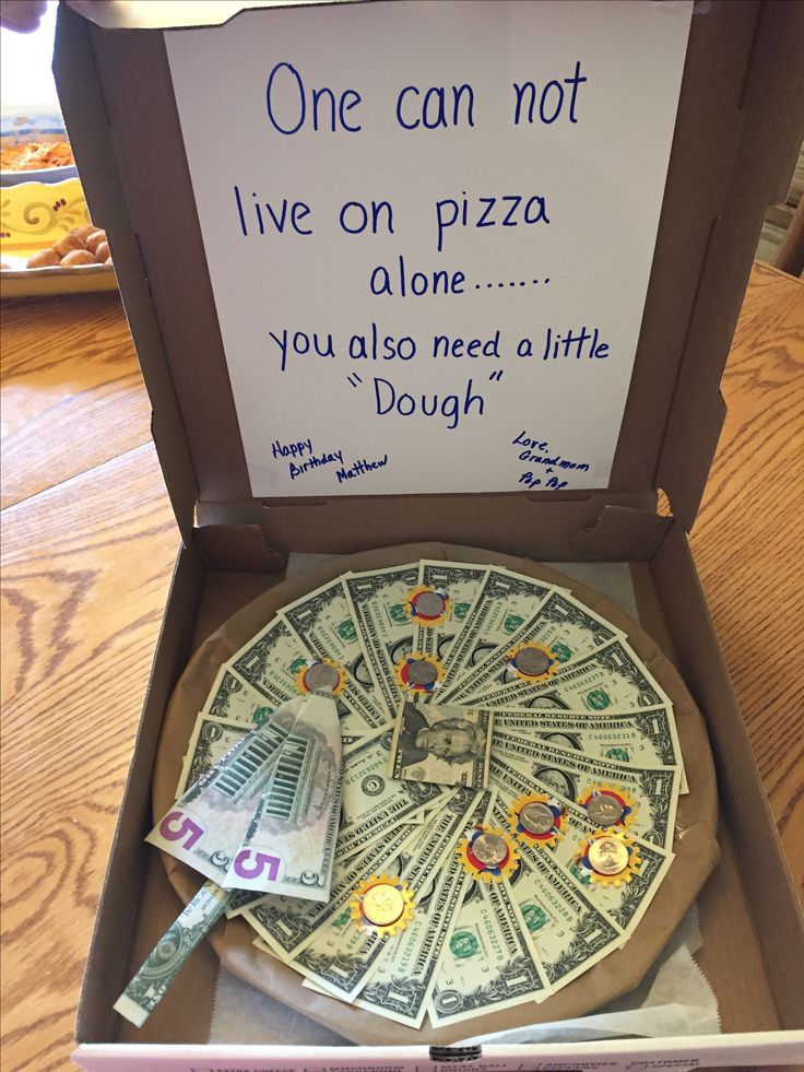 a pizza in a box with a sign on it that says, one can not live on pizza alone you also need a little dough