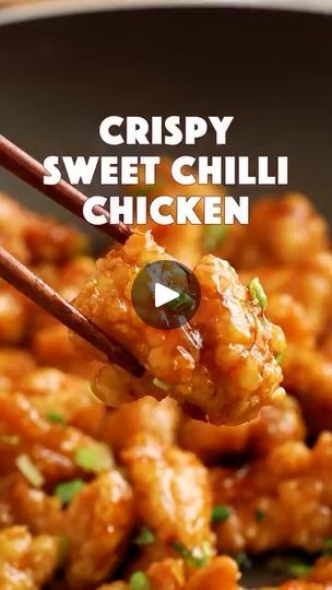 choppy sweet chilli chicken is being held up with chopsticks