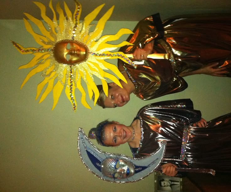 two men standing next to each other in front of a sunflower