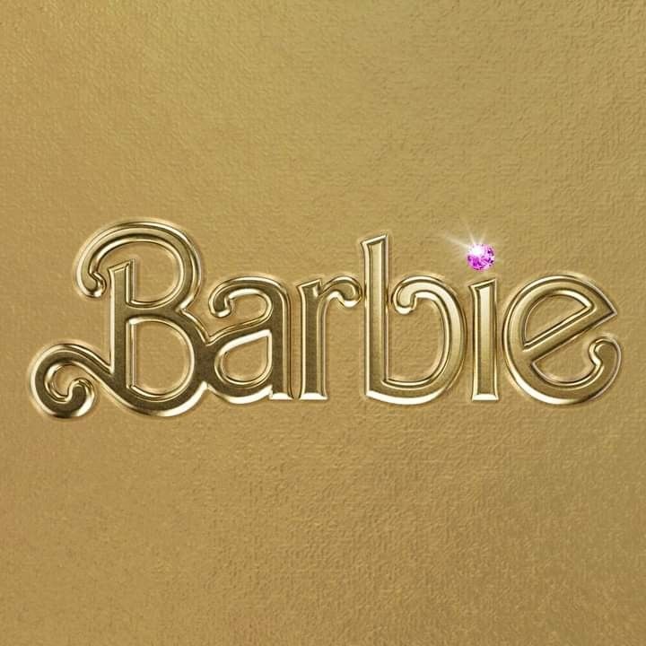 the word barbie written in cursive metal type on a gold background with a pink diamond