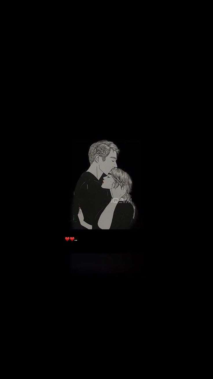 two people are kissing in the dark with their faces close to each other and one person has his arm around the woman's shoulder