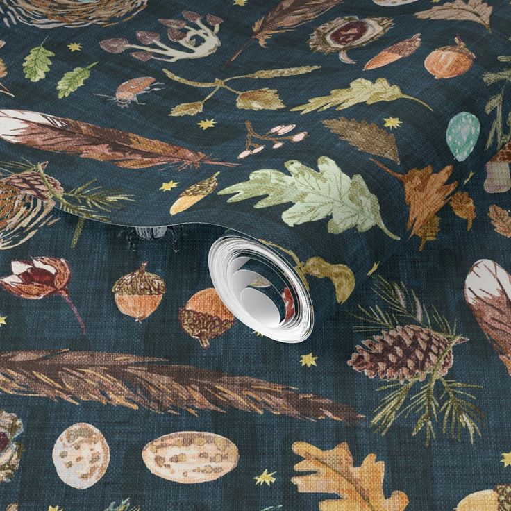 an image of a blue fabric with leaves and acorns on the back ground