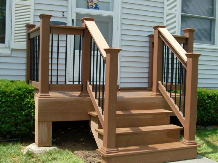 a house with stairs leading to the front door