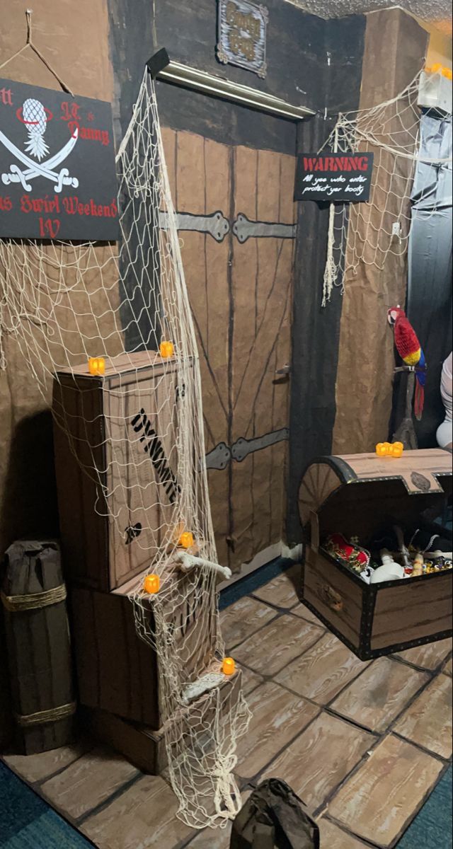 there is a rope net in front of the door to a pirate's hut