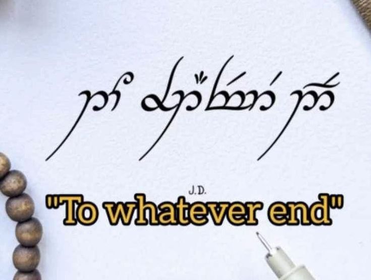 the words to whatever end are written on a piece of paper with a pen next to it