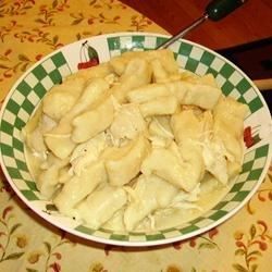 a bowl filled with food sitting on top of a table