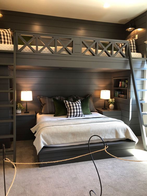 a bedroom with a loft bed and ladder