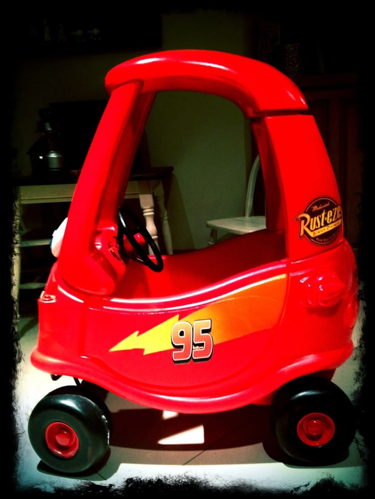 a red toy car with the number 95 on it