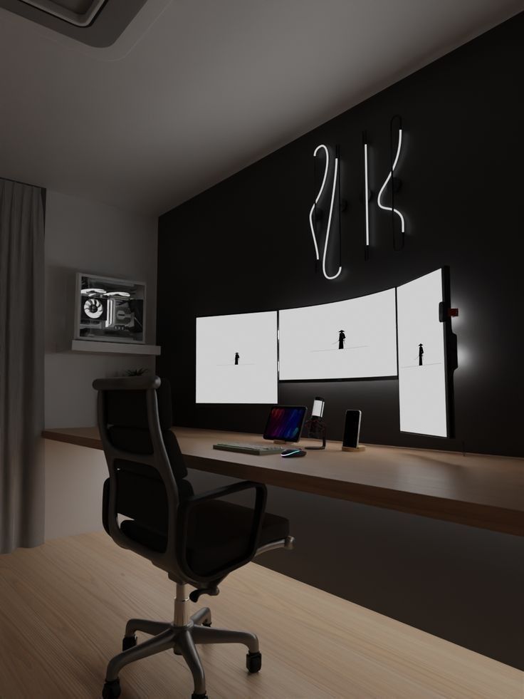 an office with black and white walls, wooden floors and a computer desk in front of it