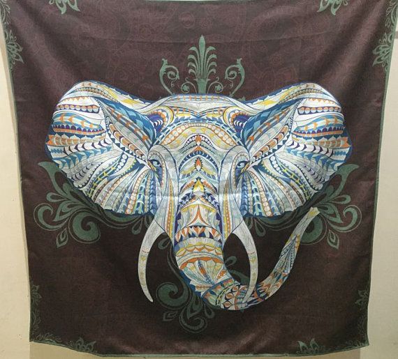 an elephant is painted on a wall hanging