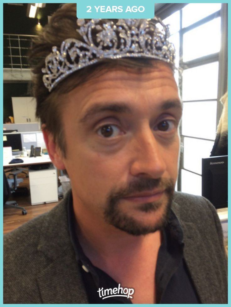 a man wearing a tiara in an office