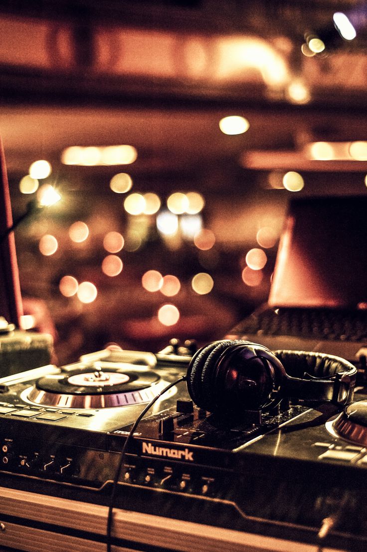 dj equipment with headphones and lights in the background