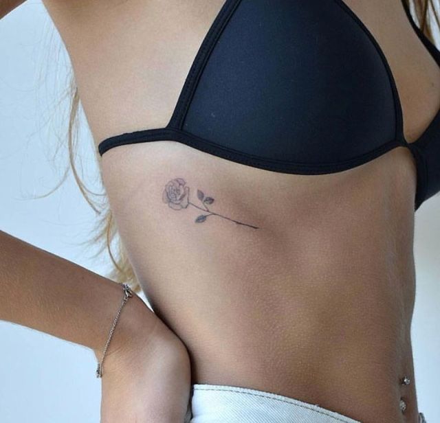 a woman with a tattoo on her stomach