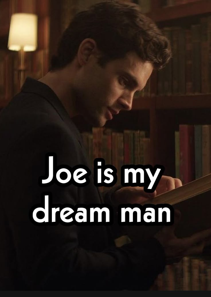 a man reading a book in front of a bookshelf with the caption joe is my dream man