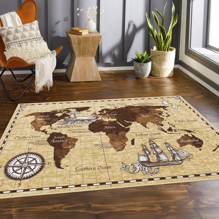 a rug with a world map on it in front of a chair and potted plant