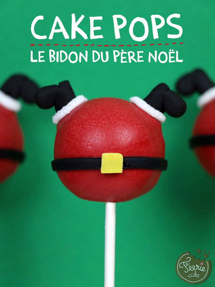 three red cake pops with black and white ears are on a green surface, one has a yellow stick in the shape of santa's head