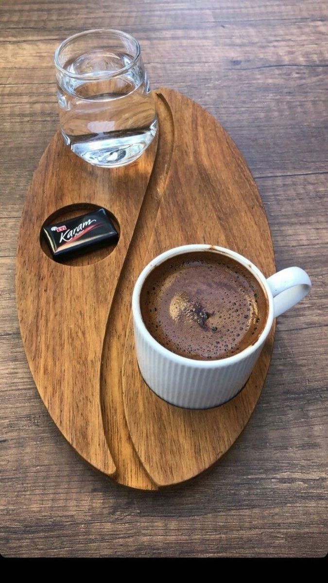 a cup of hot chocolate on a wooden tray