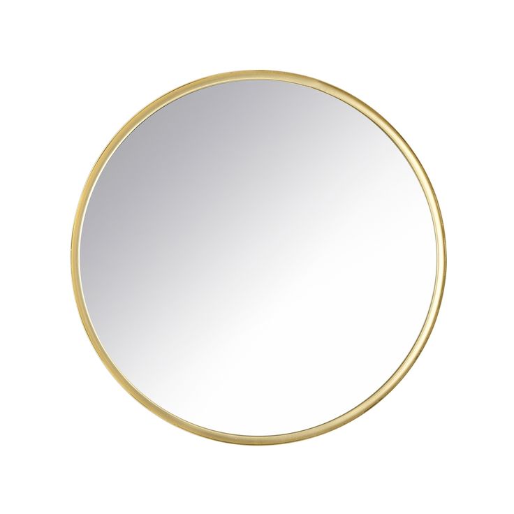 a round gold mirror on a white background