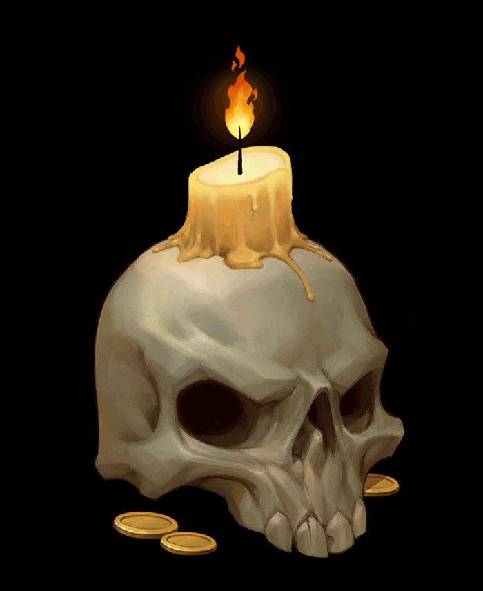 a skull with a lit candle on top of it and some gold coins around it