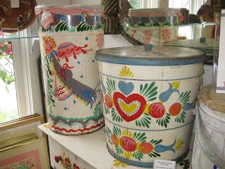 two vases sitting on top of a white shelf